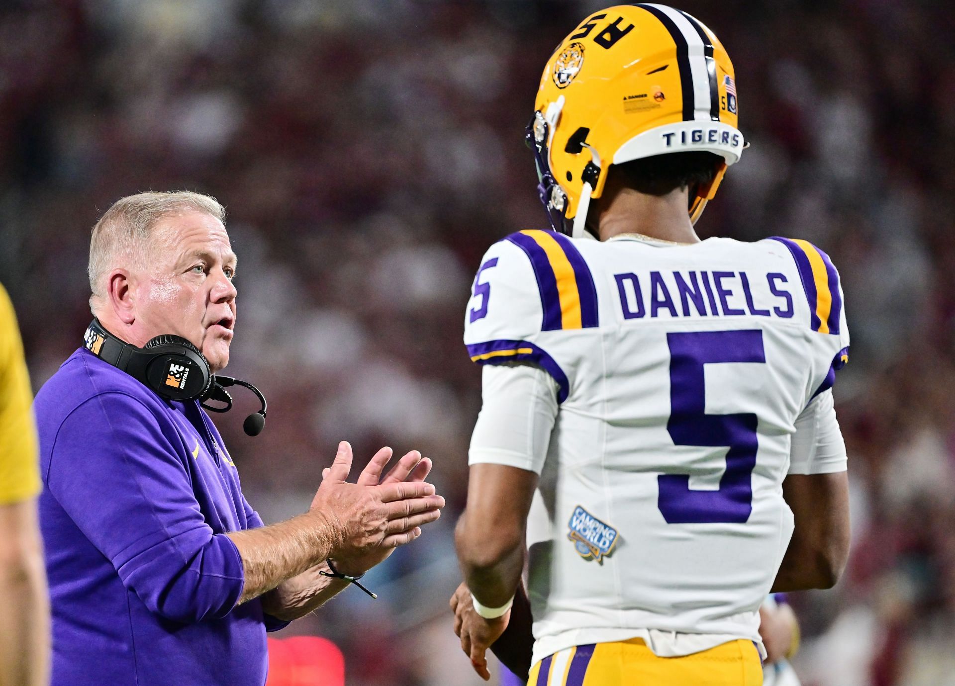 LSU coach Brian Kelly voices out instructions to Jayden Daniels.
