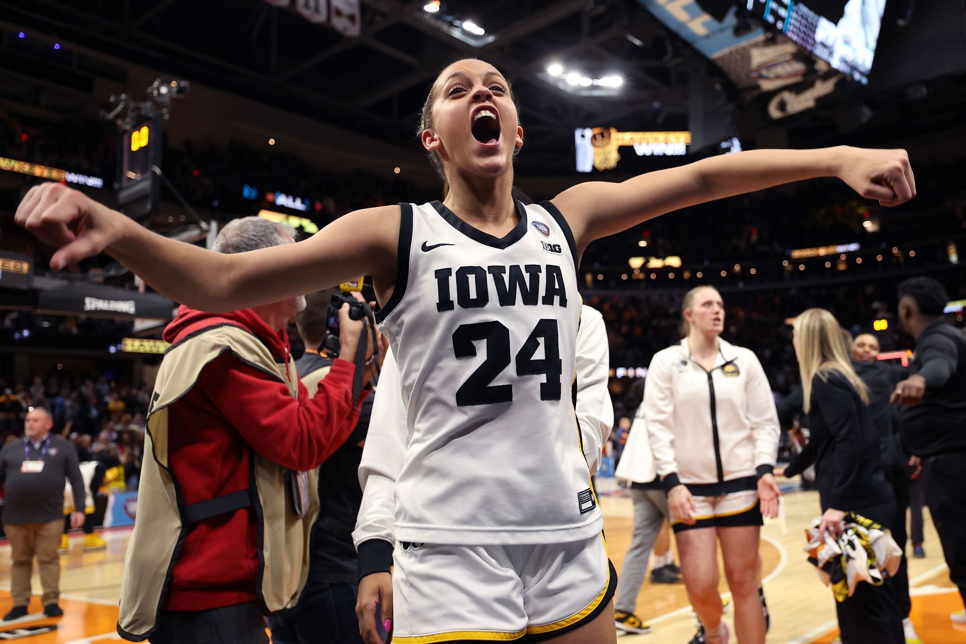 Iowa guard Gabbie Marshall celebrates after their win against UConn.