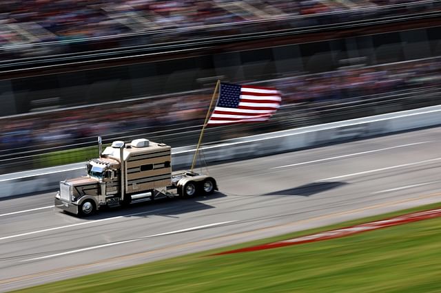 Why Is There A Truck Lap Carrying The American Flag Prior To Talladega 