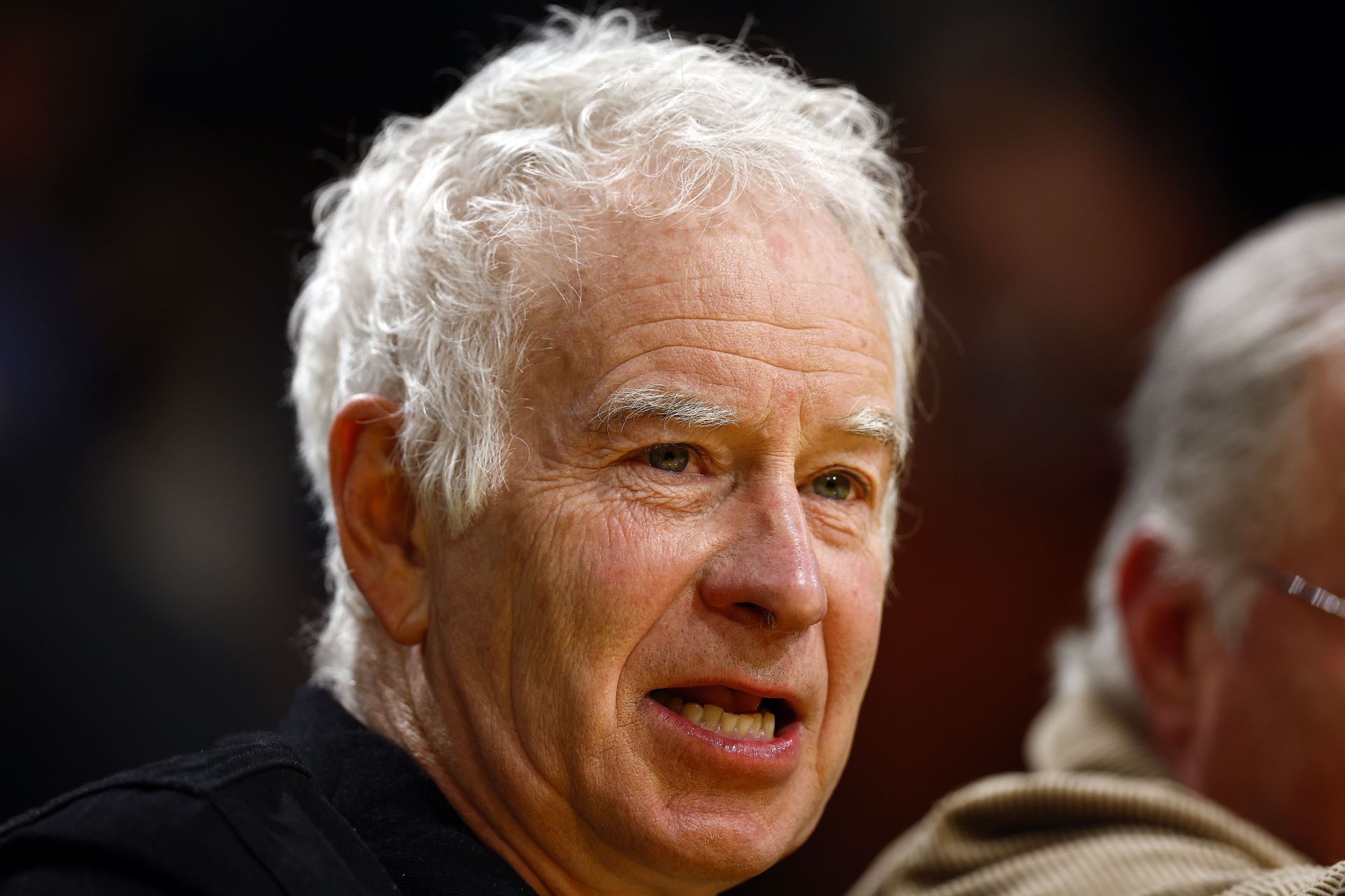 John McEnroe in attendance at an NBA game