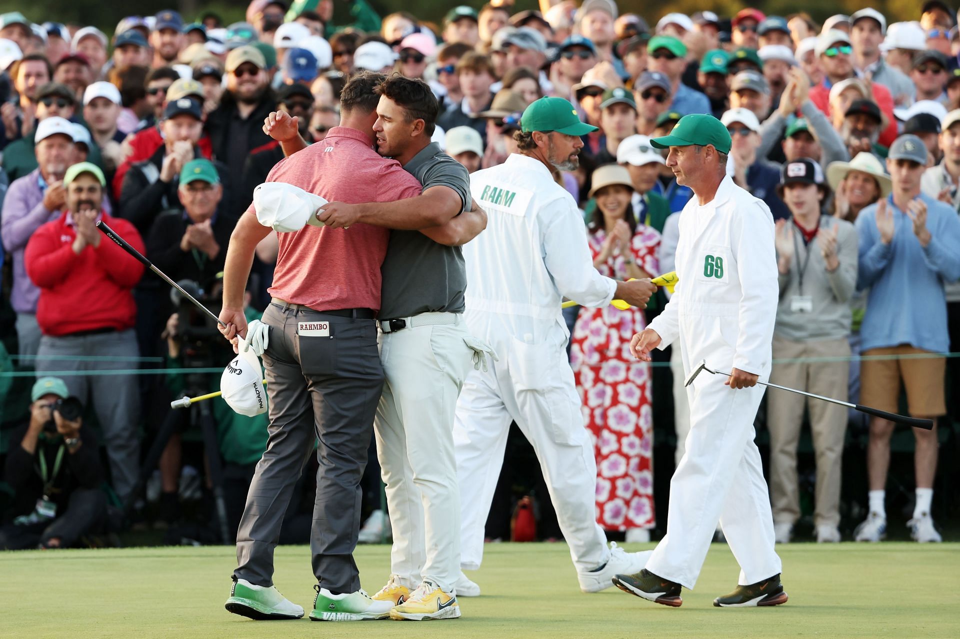 Brooks Koepka hugs Jon Rahm during the Masters 2023 Final Round