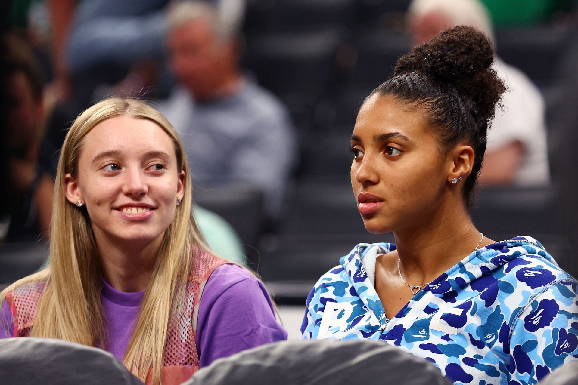 UConn teammates Paige Bueckers and Azzi Fudd watching the 2022 NBA Finals.