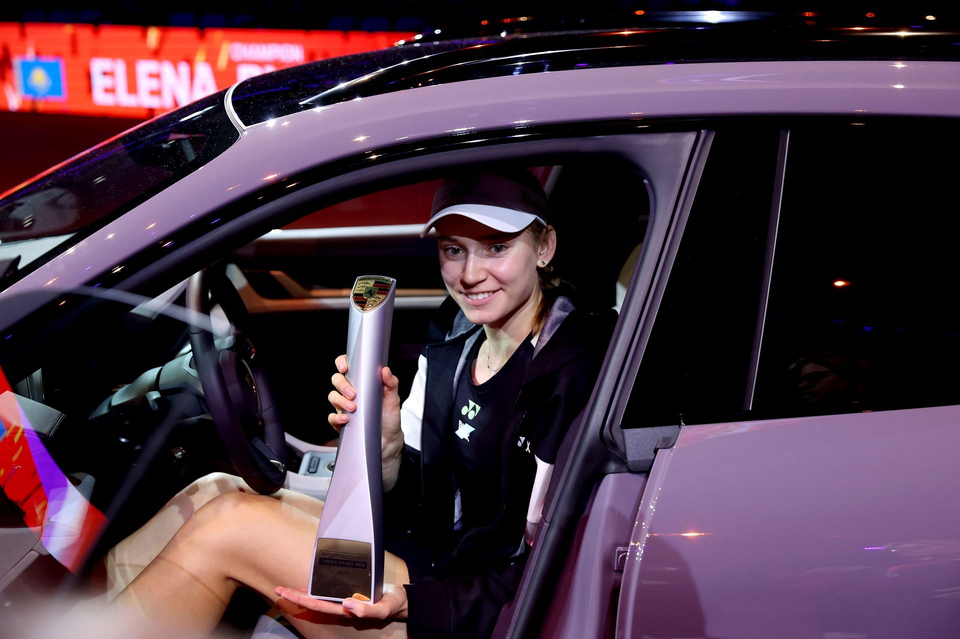 Elena Rybakina posing with the 2024 Porsche Tennis Grand Prix trophy