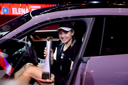 Elena Rybakina posing with the 2024 Porsche Tennis Grand Prix trophy