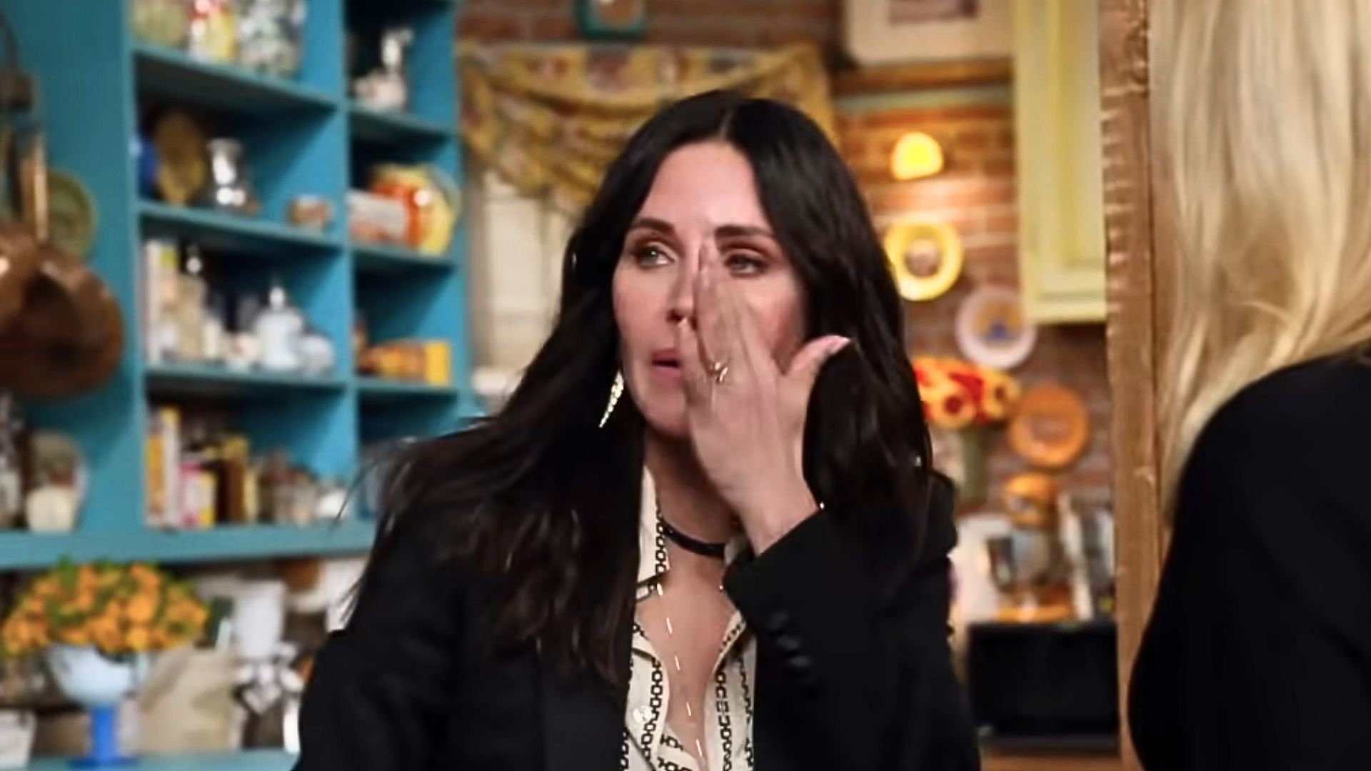 Monica is played by Courtney Cox (Image via YouTube/ Rotten Tomatoes TV, 1:28)