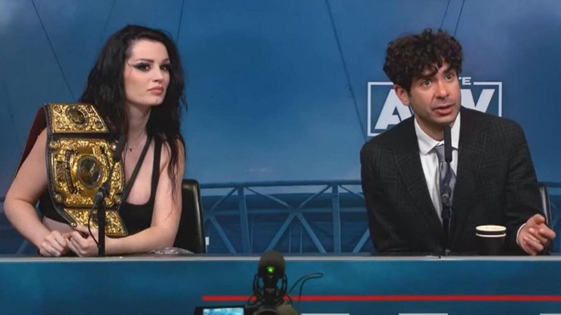 Tony Khan and Saraya at the post-show scrum for AEW All In