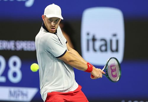 Jarry plays a backhand at the Miami Open