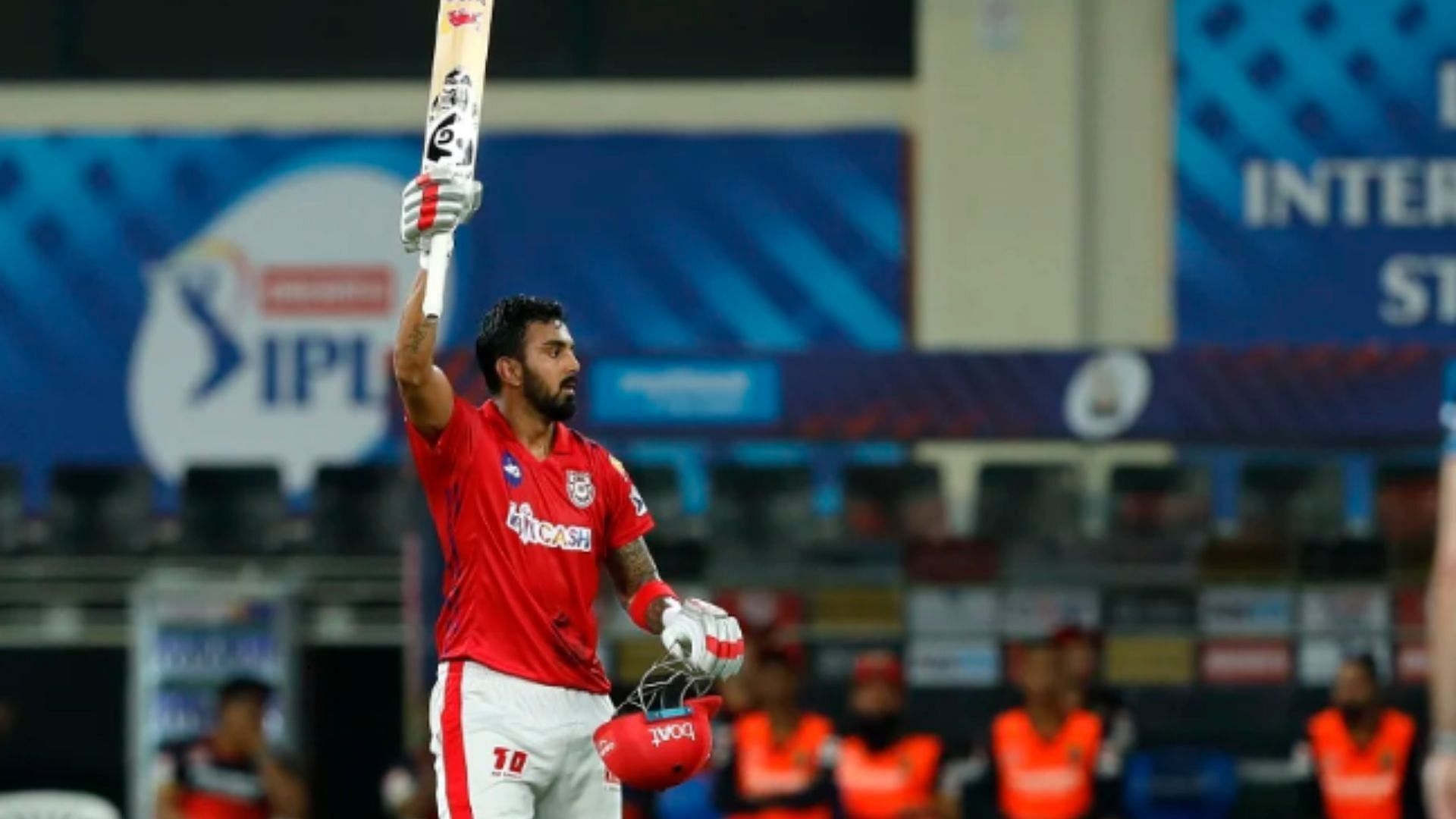 K Rahul raises his bat after scoring century against RCB in 2020. 