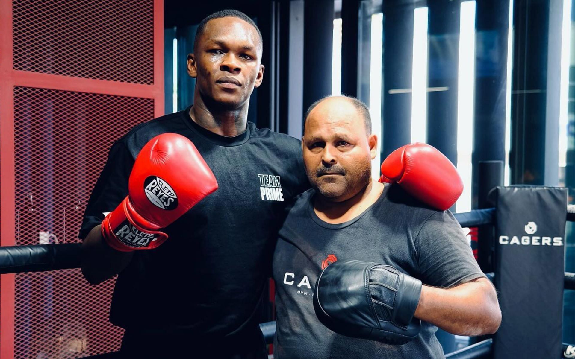 Israel Adesanya (left) honing his boxing skills during hiatus from fighting competition [Photo Courtesy @stylebender on Instagram]