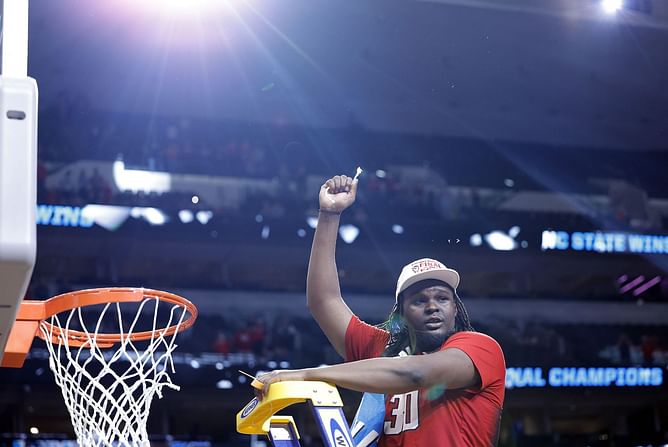 WATCH: NC State star DJ Burns shows his class by taking pictures with security after solid win over Duke in Elite Eight clash