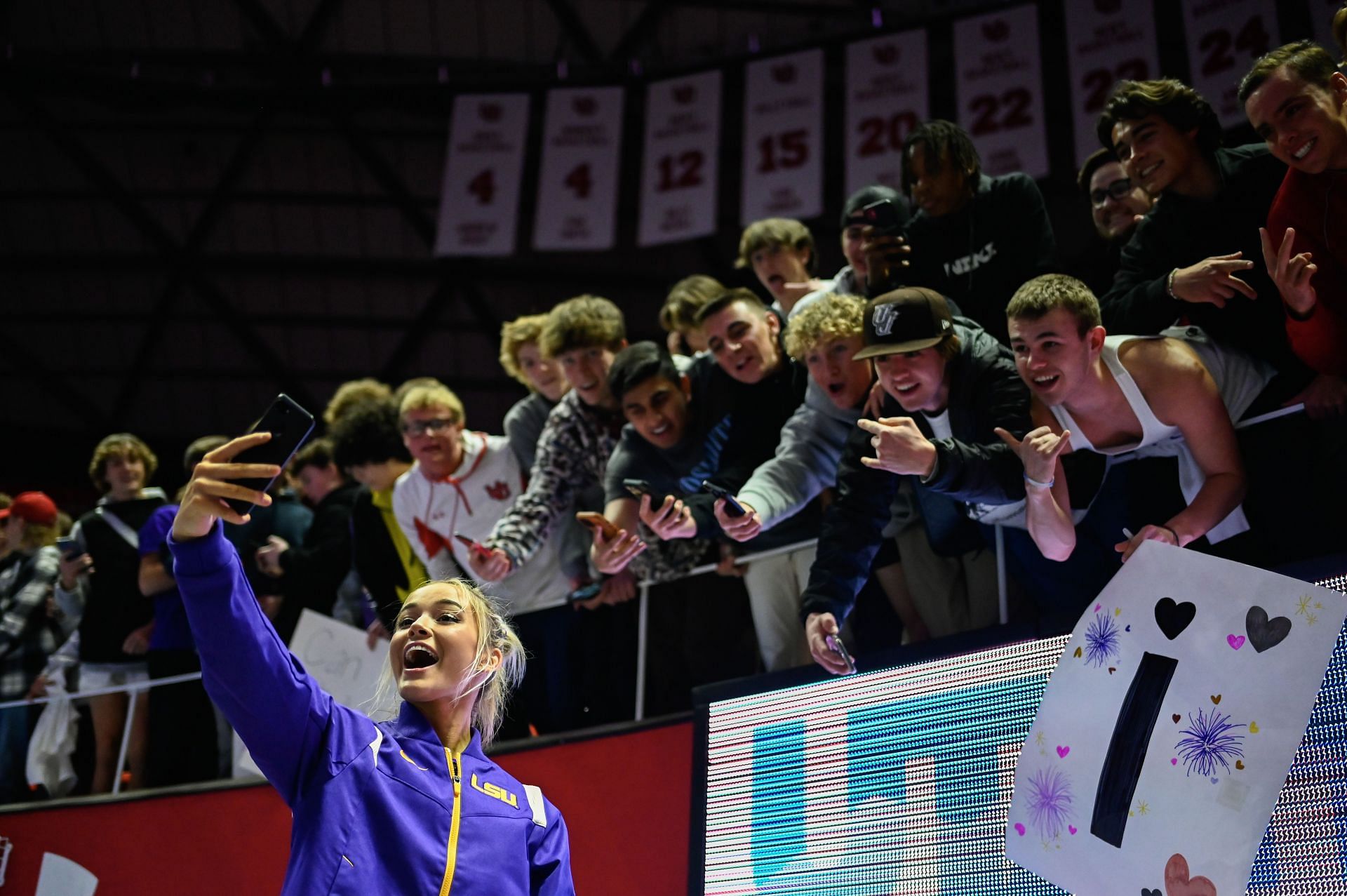 Olivia Dunne of LSU takes a &#039;selfie&#039; with fans after a PAC-12 meet against Utah at Jon M. Huntsman Center on January 06, 2023, in Salt Lake City, Utah. (Photo by Alex Goodlett/Getty Images)