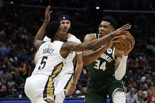 New Orleans Pelicans forward Herbert Jones (left)