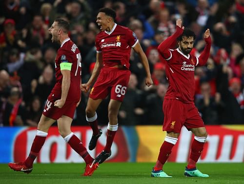 Jordan Henderson and Trent Alexander-Arnold celebrate after Salah's goal.
