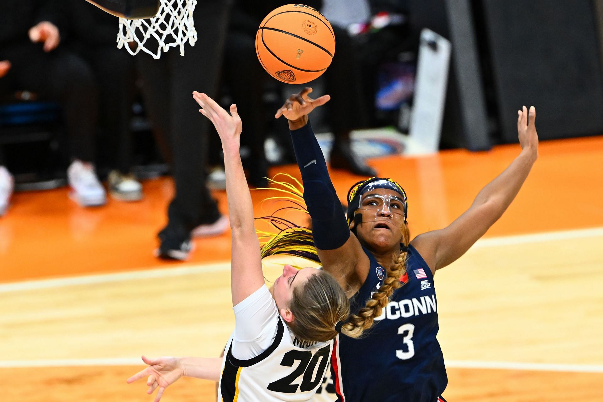 Aaliyah Edwards battles to get a rebound.