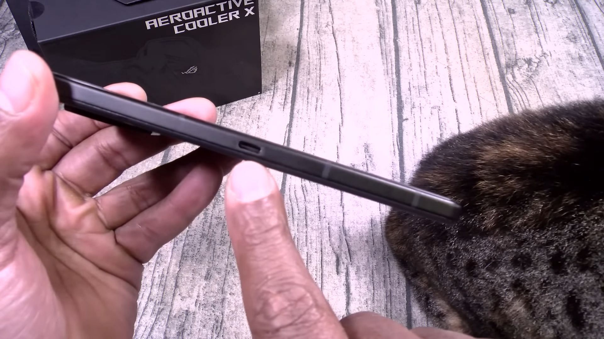 ASUS ROG Phone 8 Pro with side charging port (Image via Flossy Carter/YouTube)