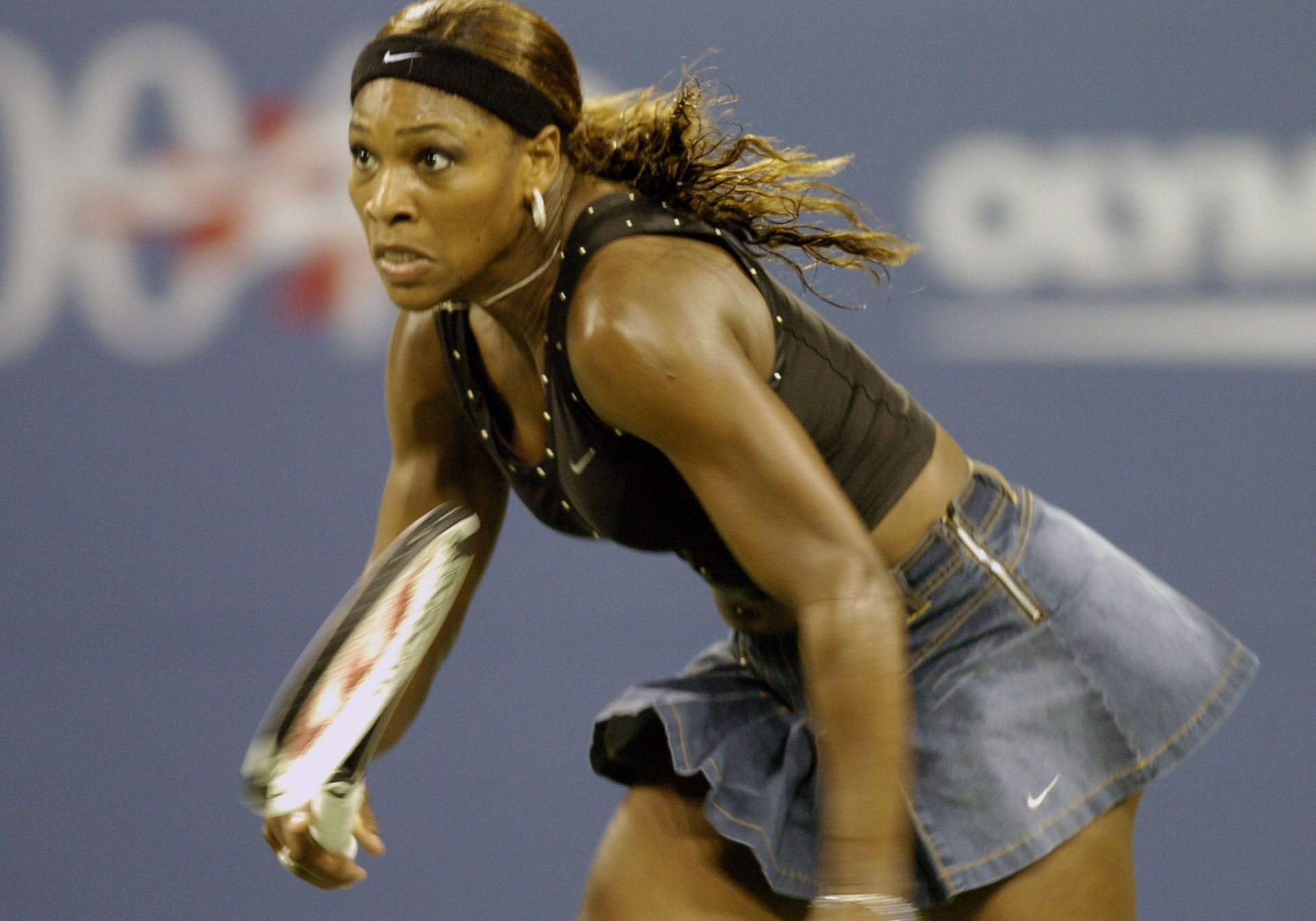 Serena Williams sports a denim miniskirt by Nike at the 2004 US Open