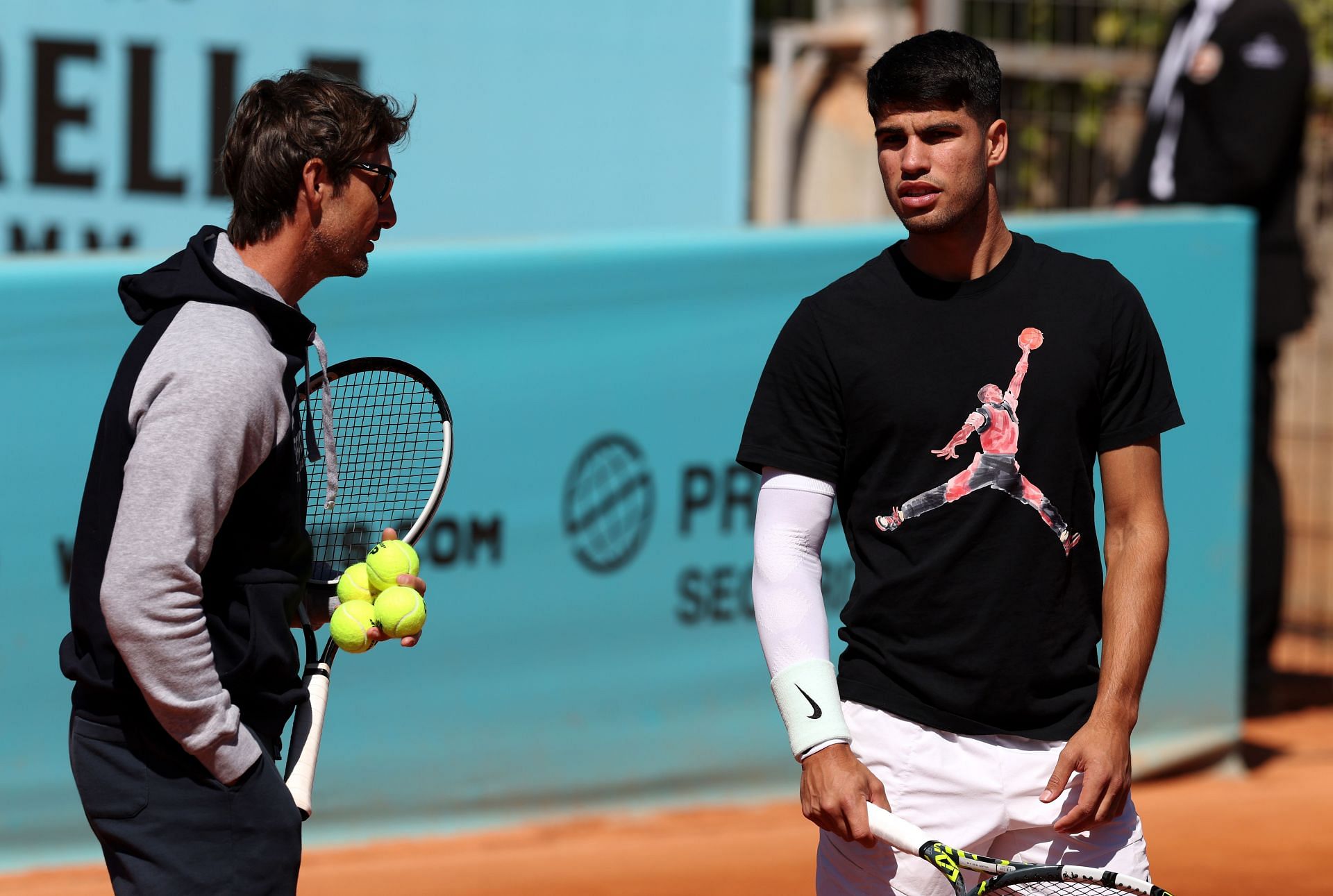 Juan Carlos Ferrero (L) and Carlos Alcaraz (R) at the 2024 Madrid Open