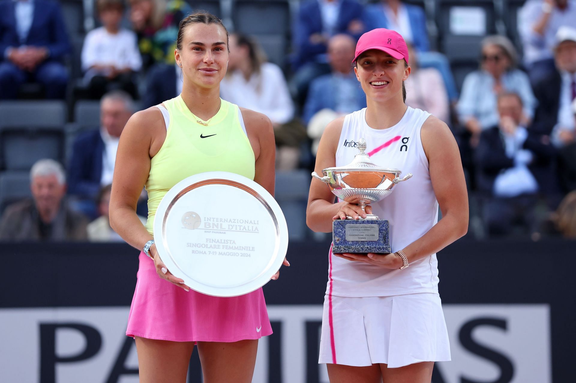 Iga Swiatek and Aryna Sabalenka pose with their trophies at the 2024 Italian Open