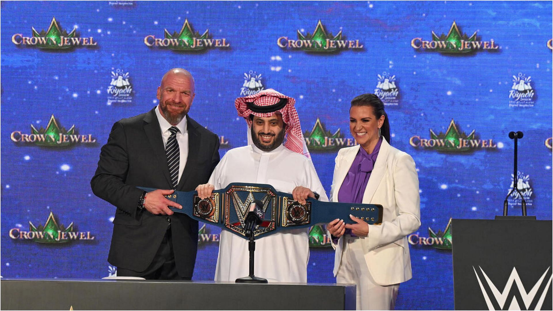 Triple H (left), Turki Alalshikh (center), and Stephanie McMahon (right) at 2022 WWE Crown Jewel conference.