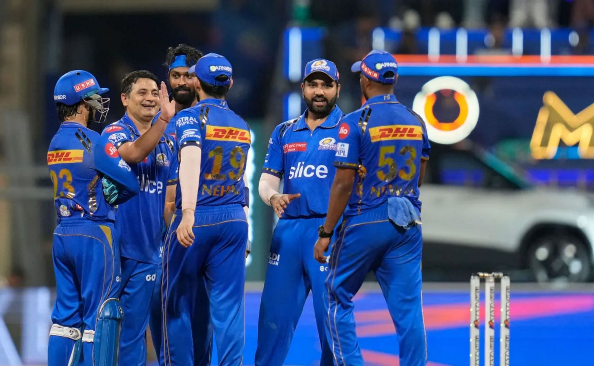 MI players celebrate a wicket on Friday. 