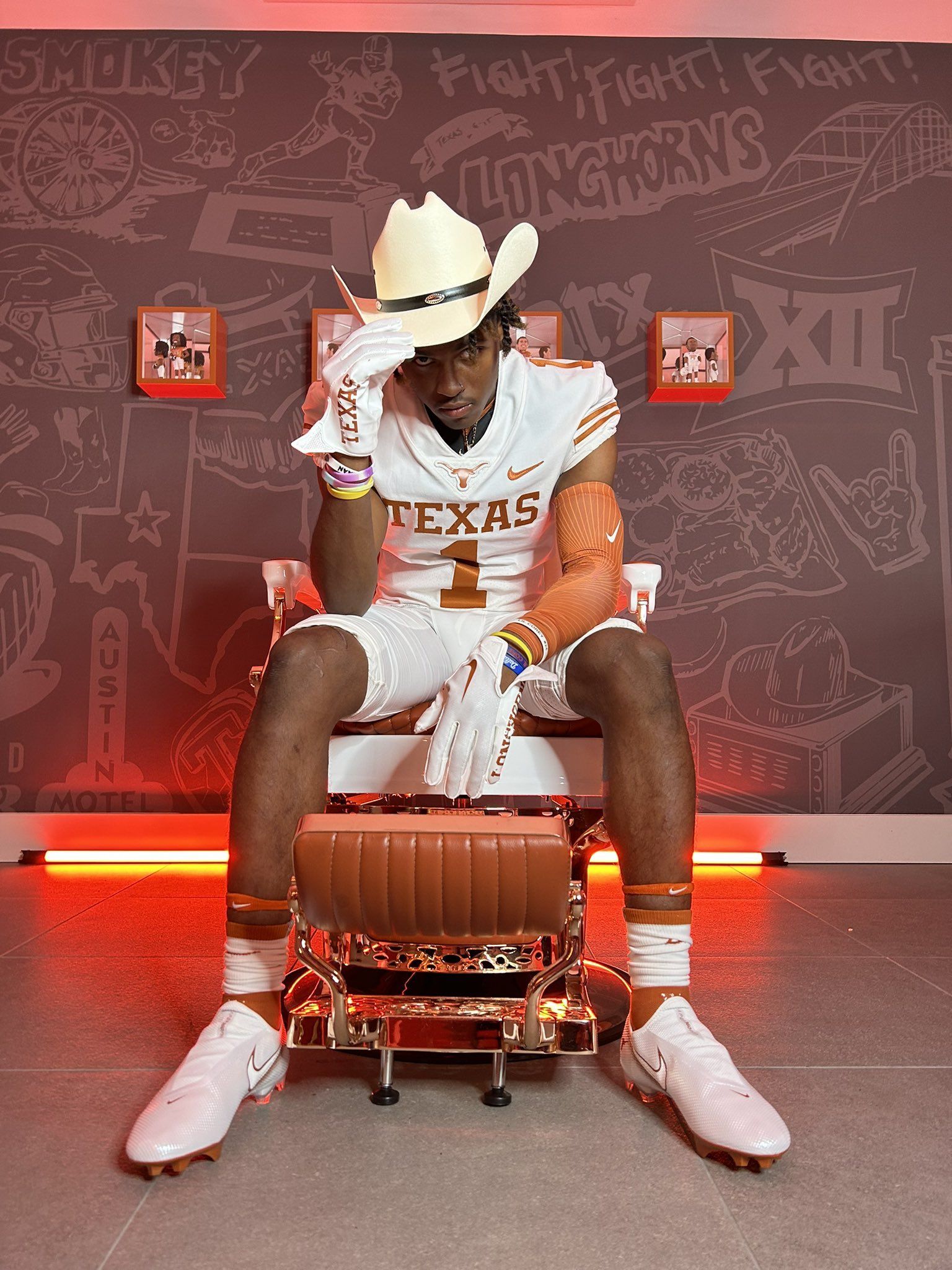 Dakorien Moore tries on the Burnt Orange and White during an unofficial visit to the University of Texas (photo credit: University of Texas Longhorns and Dakorien Moore)