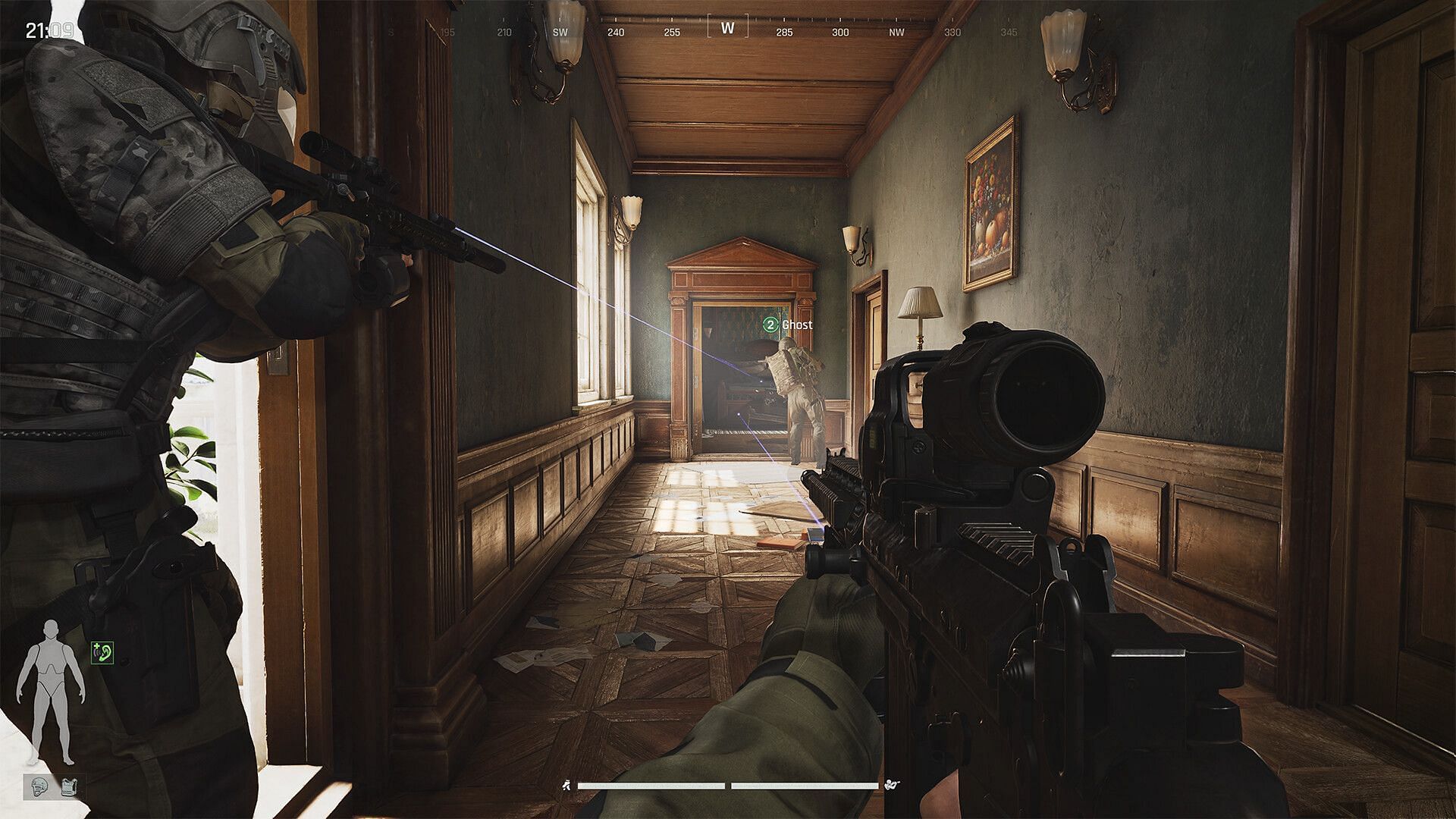 An Operator holding a rifle in a hallway 