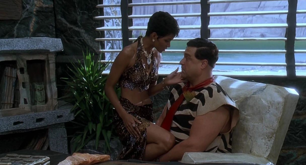 Sharone Stone seducing Fred Flintstone (Image via Warner Bros.)