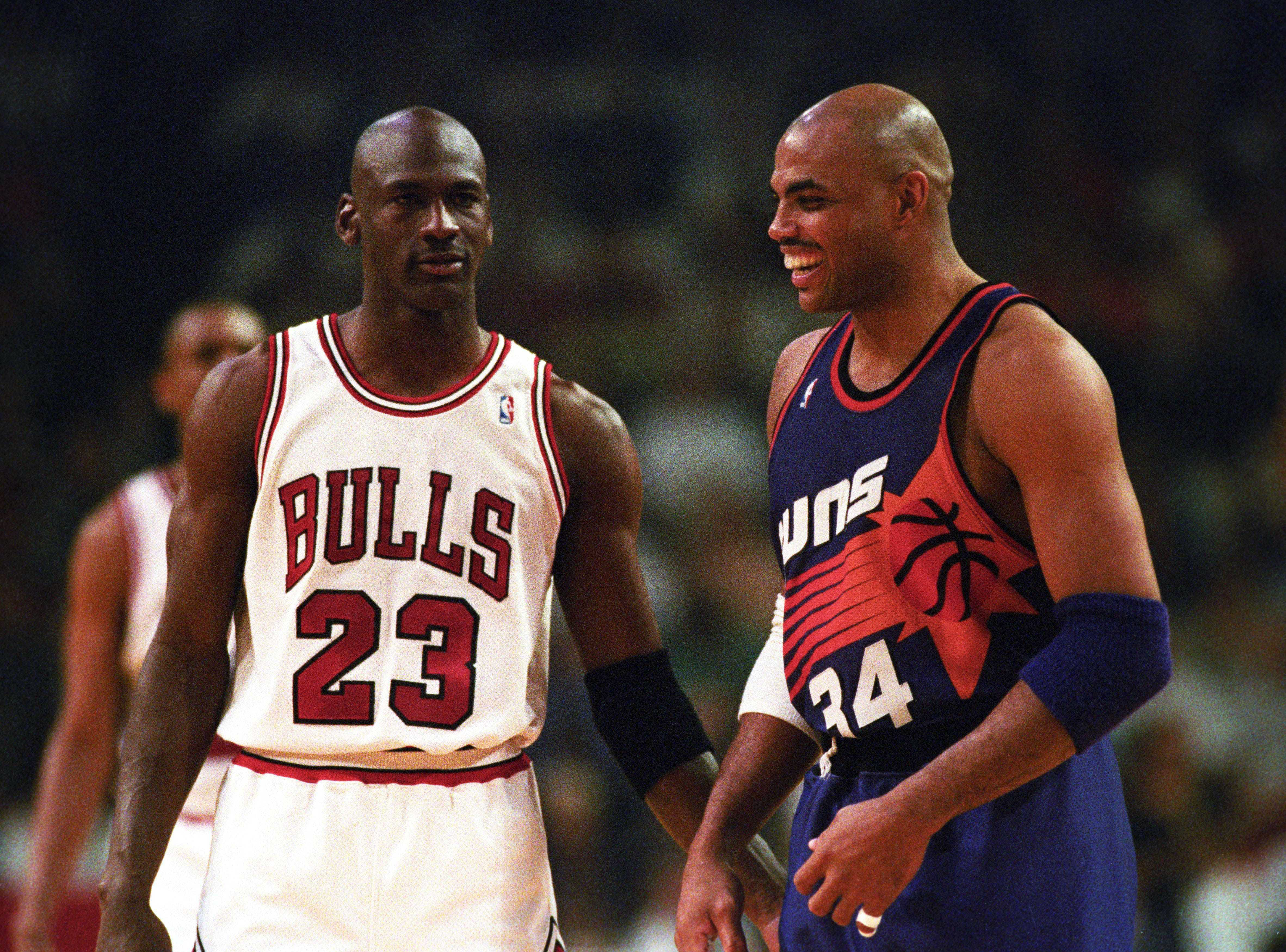 The Chicago Bulls&#039; Michael Jordan up against the Phoenix Suns&#039; Charles Barkley