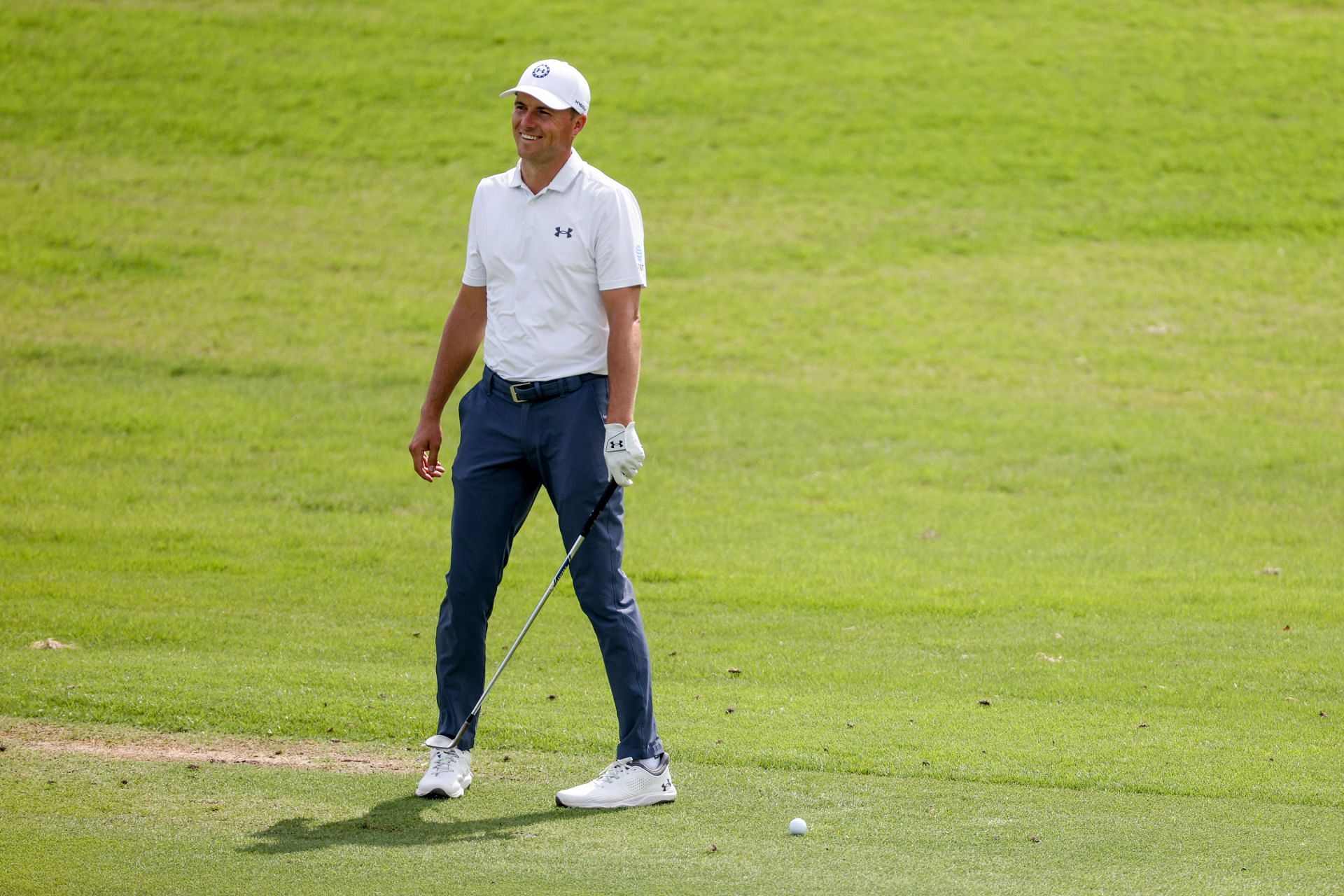 Jordan Spieth reacts to a bug near his ball before hitting an approach shot on the 10th hole during the second round of the CJ Cup Byron Nelson