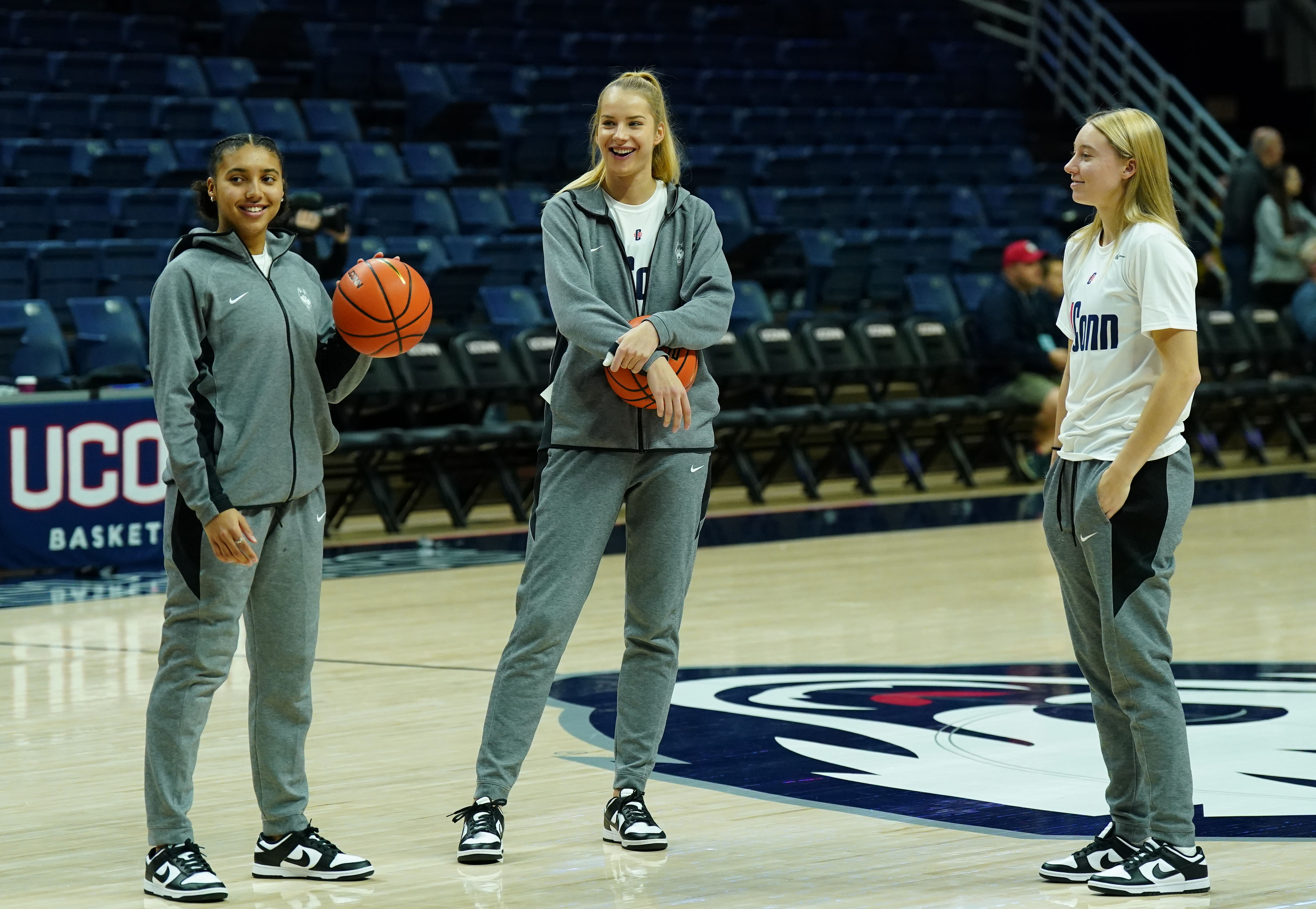 Dorka Juhasz (mid) and Paige Bueckers (right) with UConn in December 2022