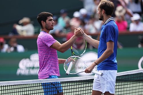 Carlos Alcaraz (L) and Daniil Medvedev (R) shaking hands after the conclusion of the 2024 BNP Paribas Open men's singles final