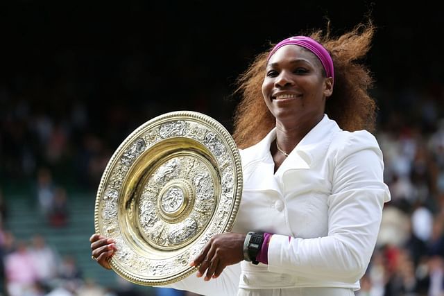 Serena Williams poses with the 2012 Wimbledon title