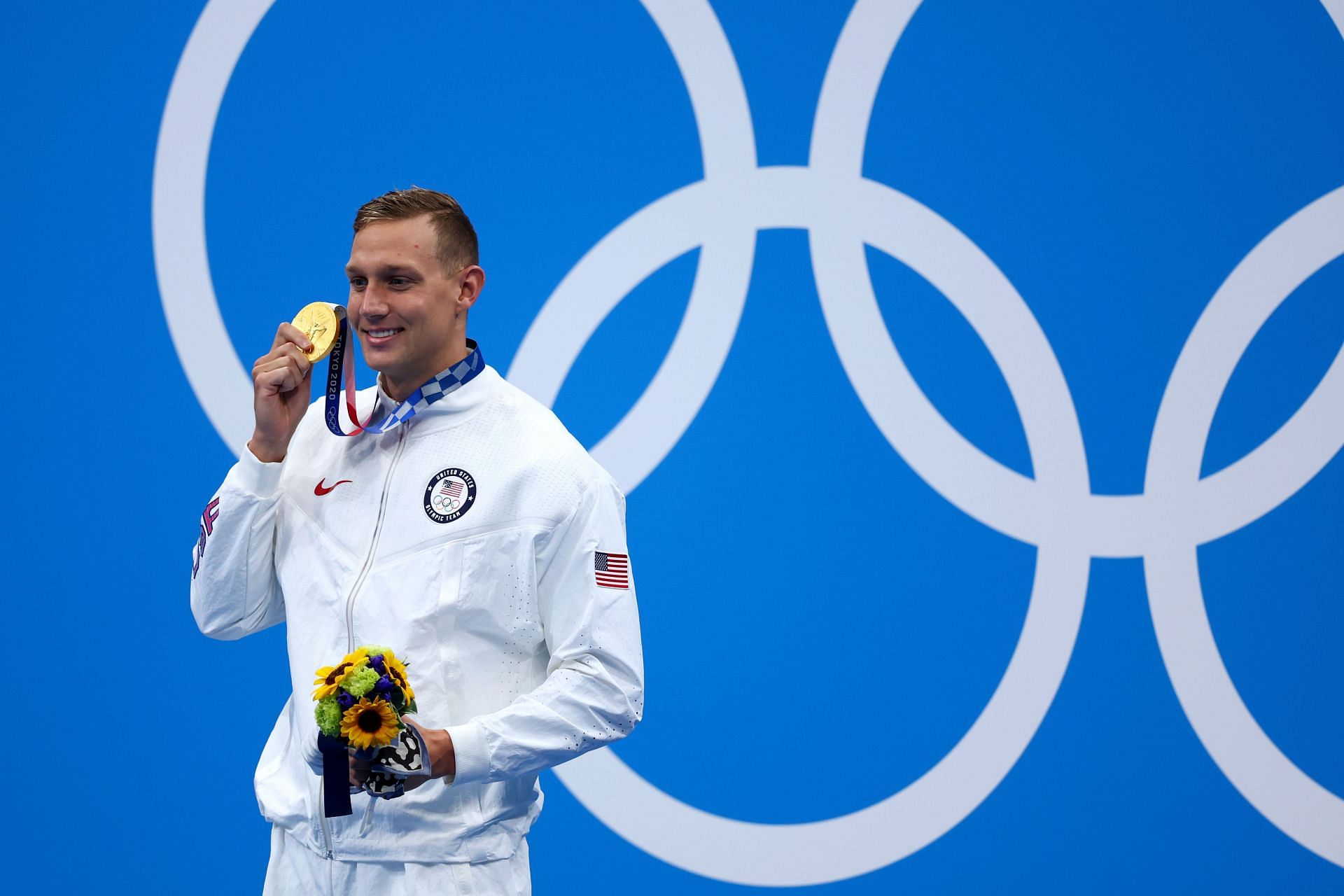 Caeleb Dressel poses with the gold medal for the Men&#039;s 50m Freestyle Final at the 2020 Olympic Games in Tokyo, Japan.