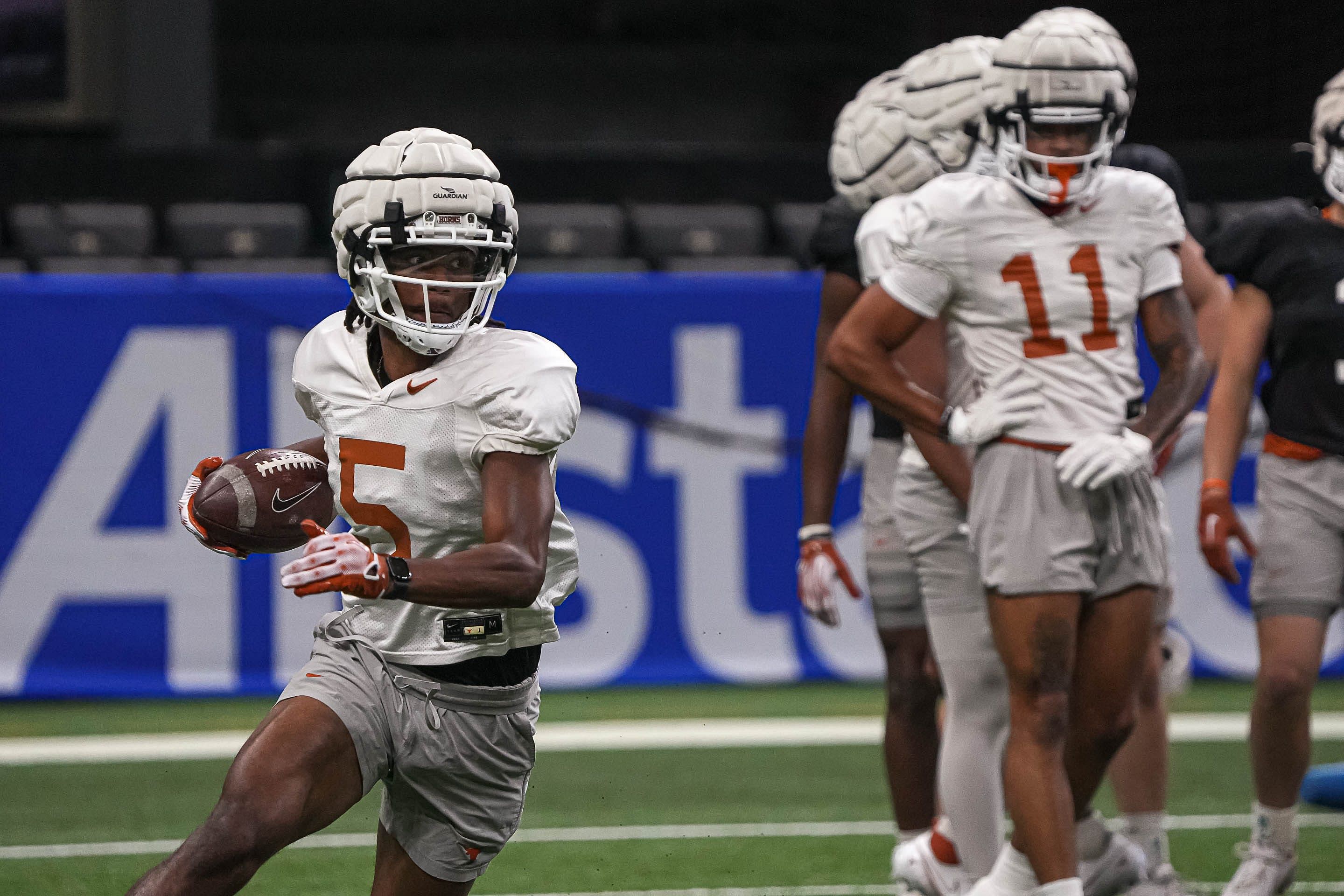 Texas Longhorns wide receiver Adonai Mitchell (5) runs drills during practice.