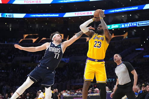 Dallas Mavericks guard Luka Doncic contesting LA Lakers' LeBron James's shot