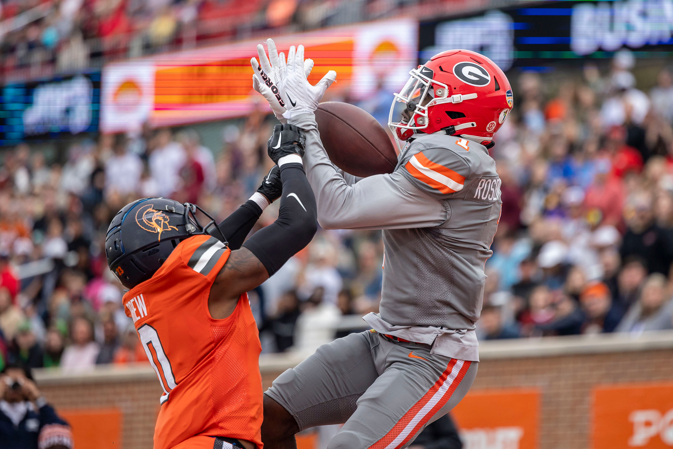 Marcus Rosemy-Jacksaint of Georgia (1) grabs a touchdown pass over National defensive back Willie Drew of Virginia State