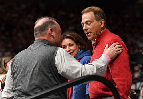 Alabama Crimson Tide former football head coach Nick Saban and his wife Terry are greeted by friends