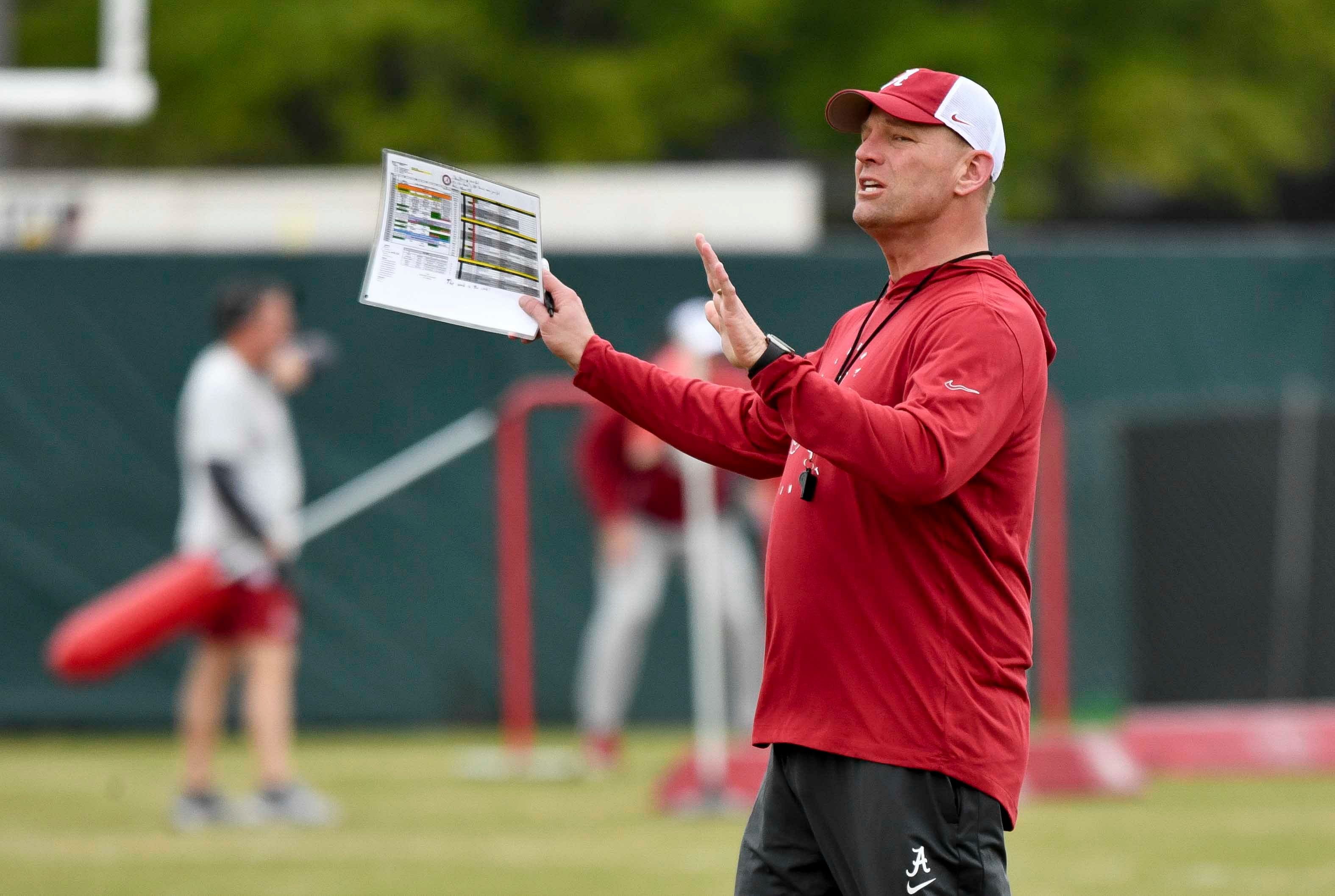 Alabama head coach Kalen DeBoer gives directions during practice.