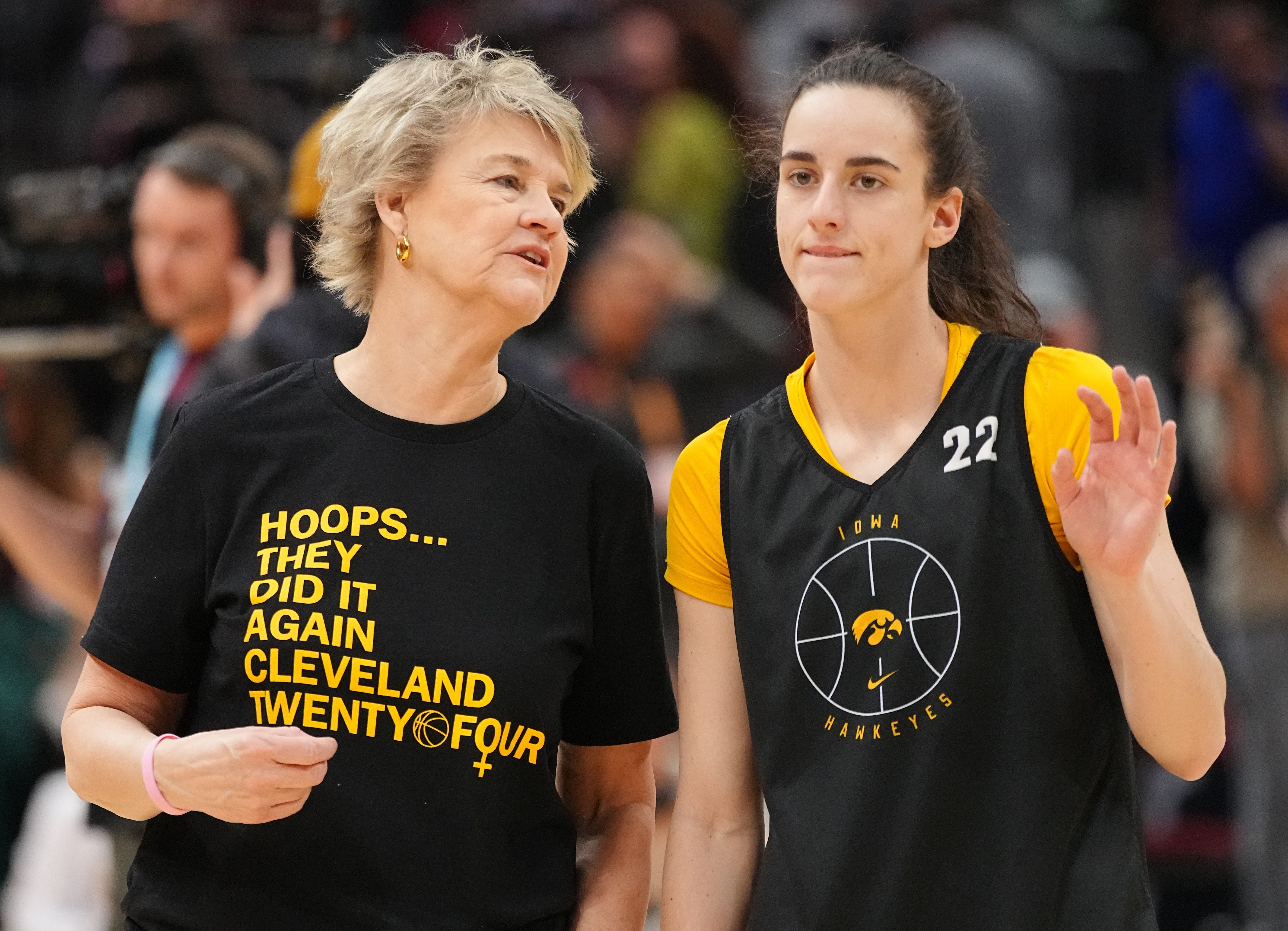 Iowa coach Lisa Bluder (left) talks to Caitlin Clark (right) in one of the team&#039;s practices.