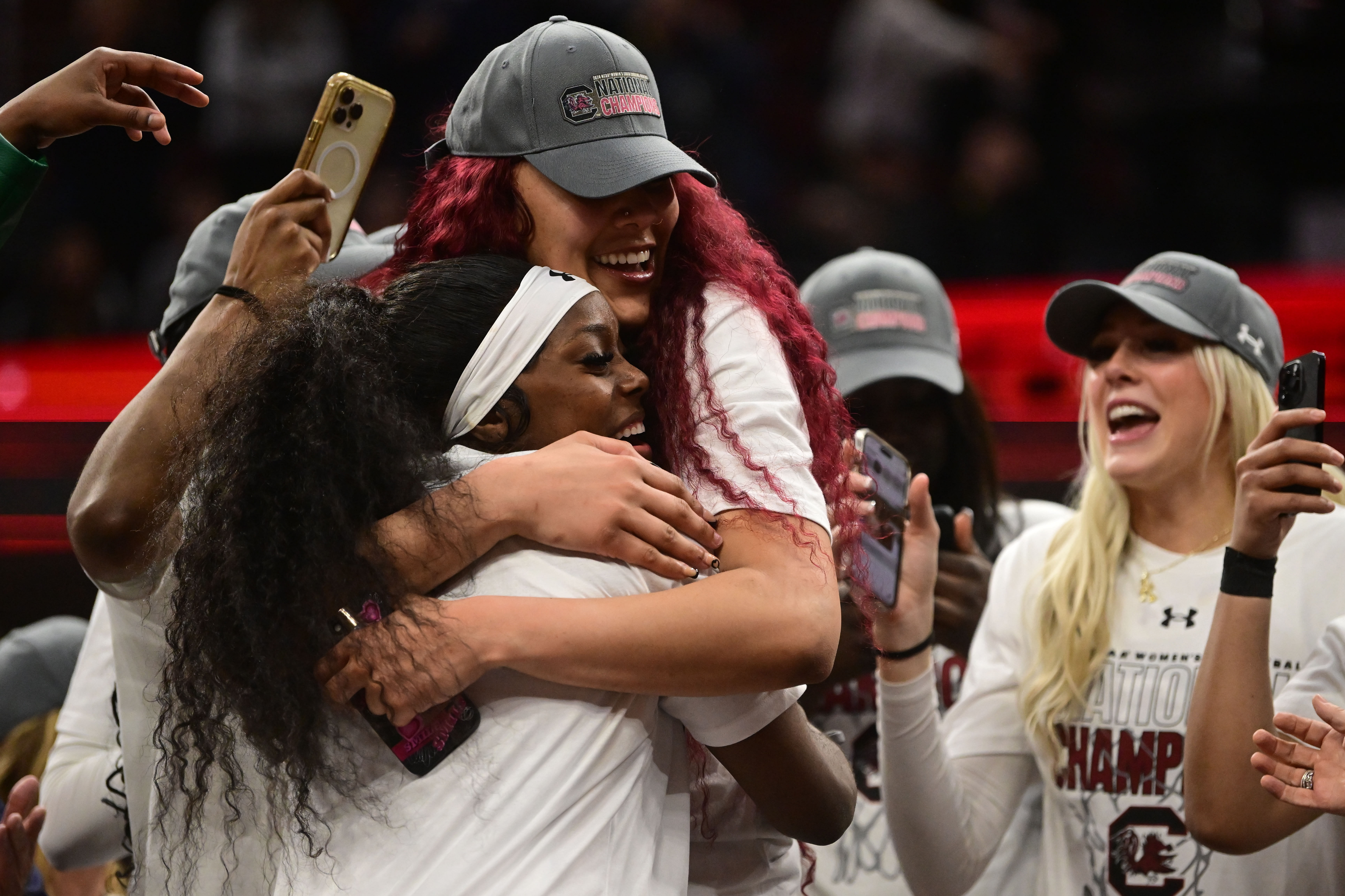 Apr 7, 2024; Cleveland, OH, USA; South Carolina Gamecocks center Kamilla Cardoso (10) reacts with guard Raven Johnson (25) during the trophy presentation after defeating the Iowa Hawkeyes in the finals of the Final Four of the women&#039;s 2024 NCAA Tournament at Rocket Mortgage FieldHouse. Mandatory Credit: Ken Blaze-USA TODAY Sports