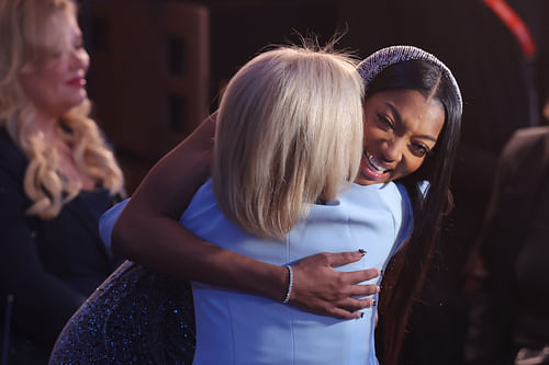 After being picked in the WNBA Draft, Angel Reese hugs coach Kim Mulkey.