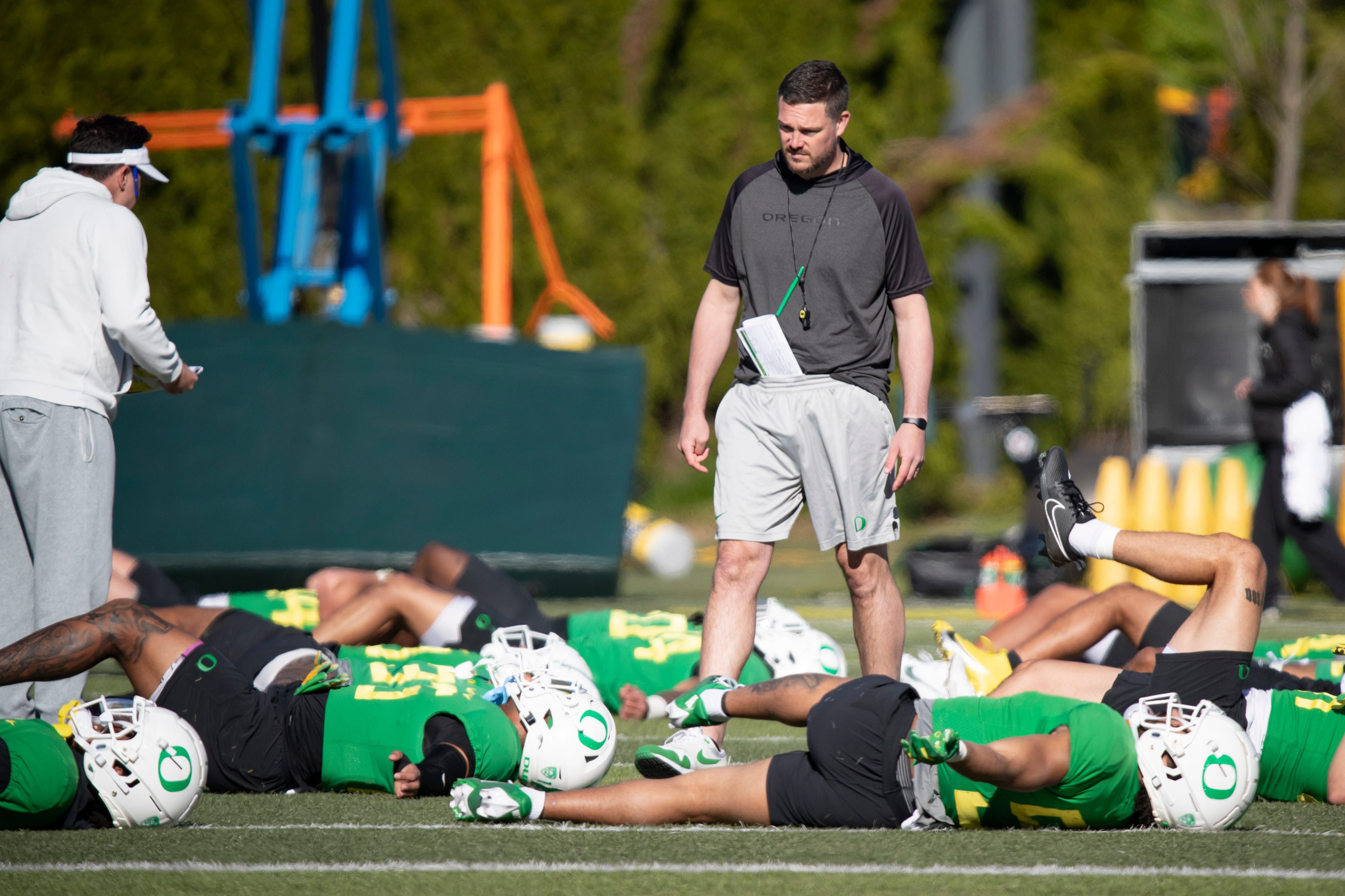 Syndication: The Register Guard: Oregon head coach Dan Lanning walks the field during practice with the Ducks Thursday, April 18, 2024, at the Hatfield-Dowlin Complex in Eugene, Ore.