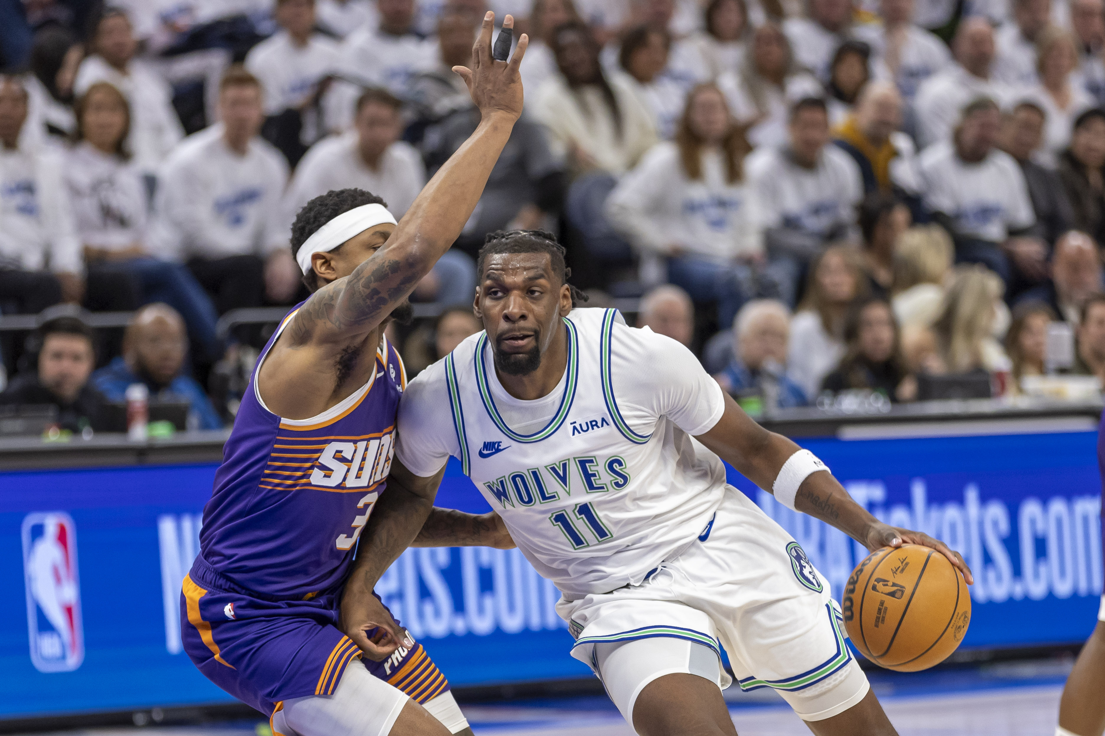 Minnesota Timberwolves big man Naz Reid (right)