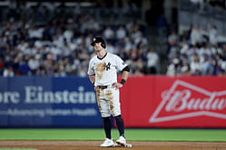 WATCH: Aaron Boone helps Jon Berti walk off the field after sustaining injury