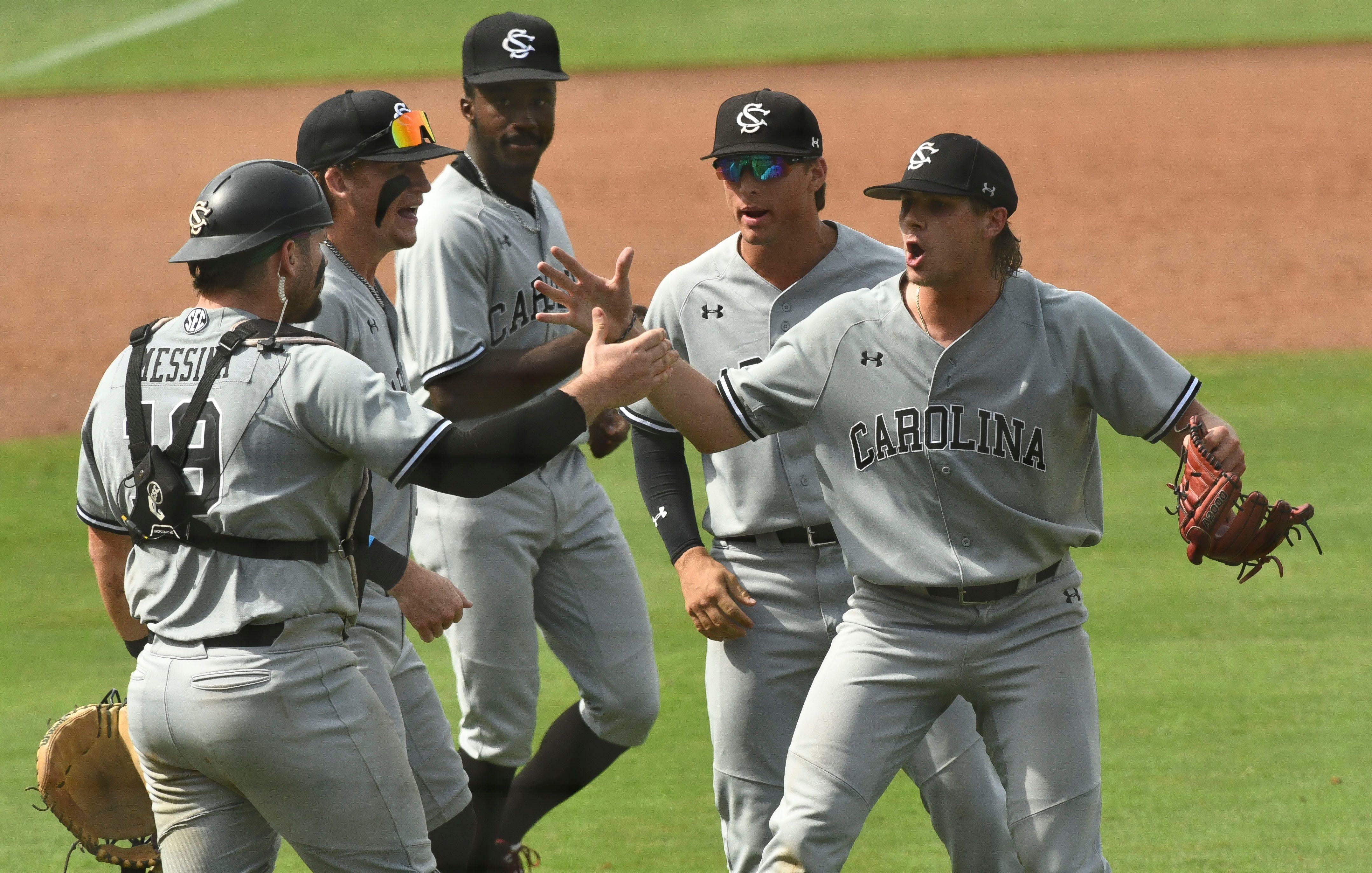 Cole Messina celebrates a hard-fought victory over the Arkansas Razorbacks with his South Carolina Gamecocks teammates.