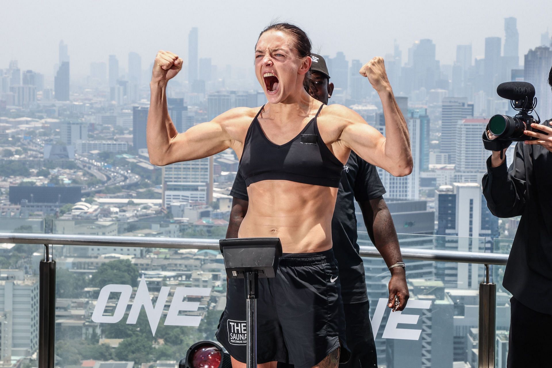 Natalia Diachkova poses on the scale at the ONE Fight Night 22 ceremonial weigh-ins.