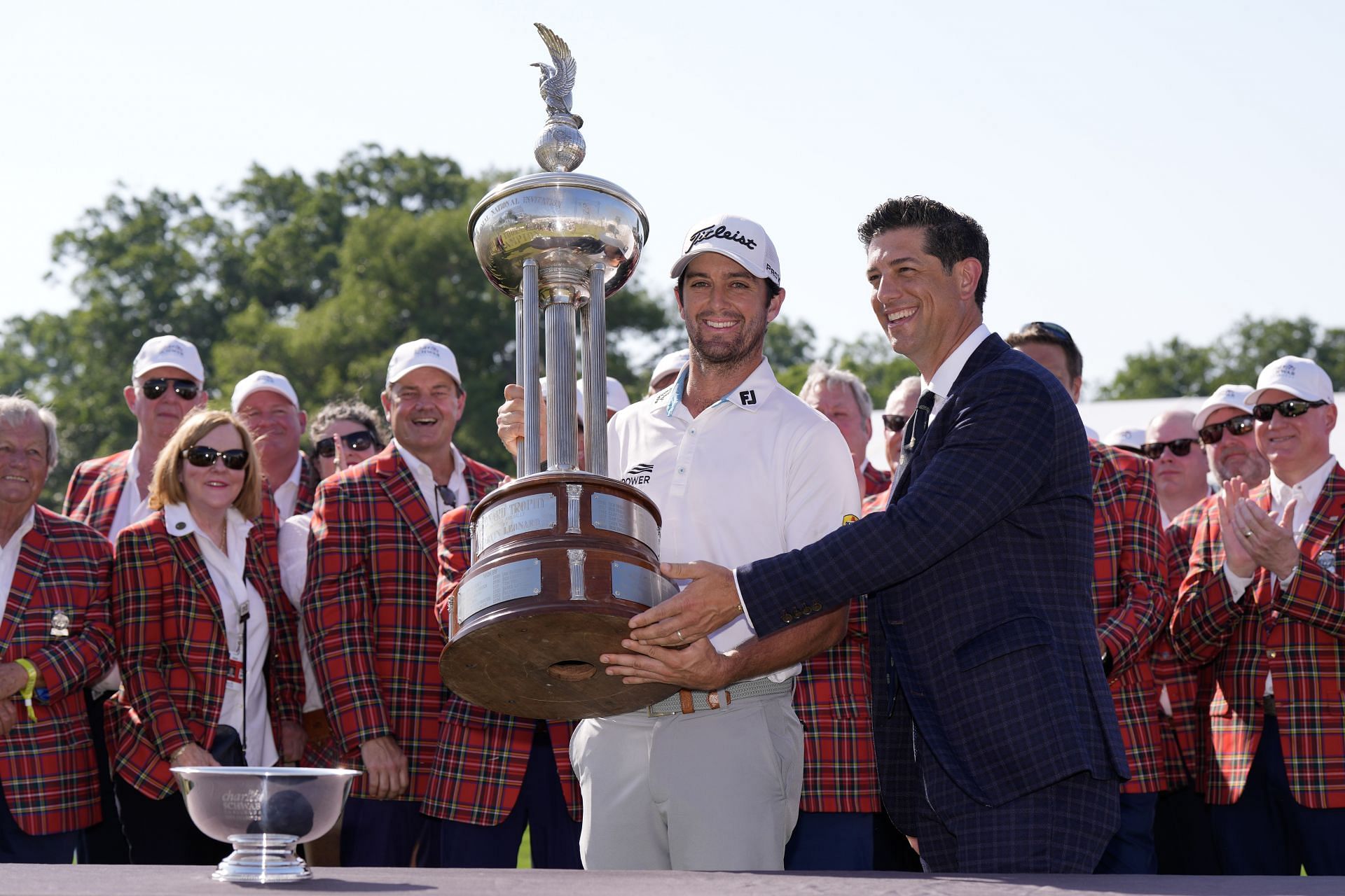 Davis Riley holds aloft the trophy after winning the 2024 Charles Schwab Challenge