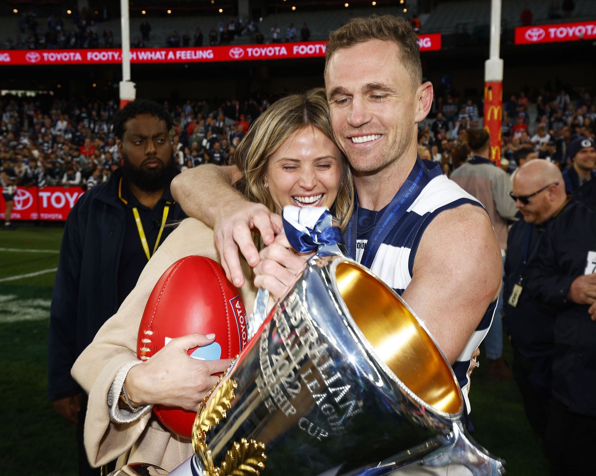 Joel Selwood of the Cats and partner Brit Davis celebrate winning the 2022 AFL Grand Final