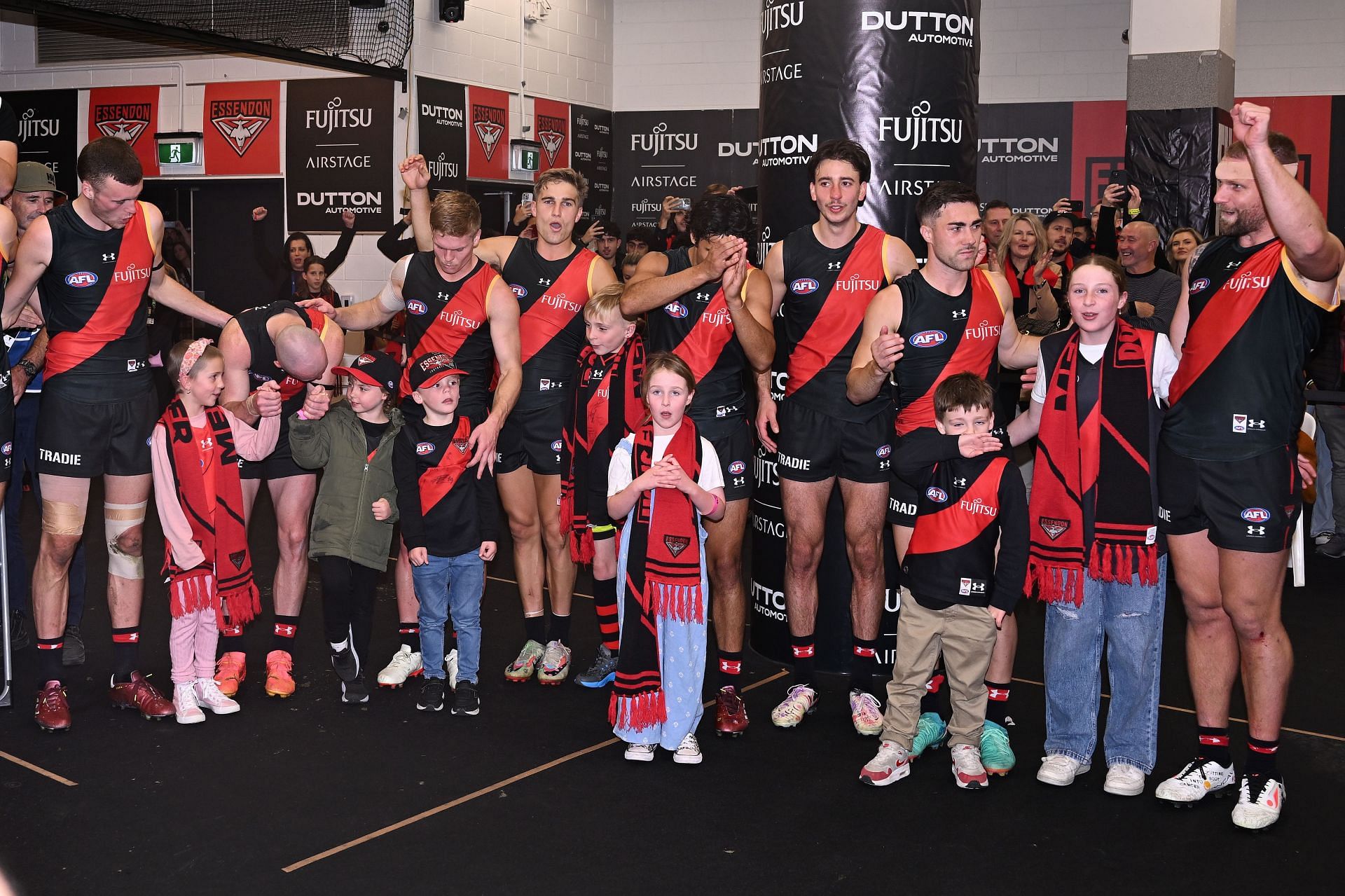 The Bombers sing the team song after winning the round nine AFL match between Essendon Bombers and Greater Western Sydney Giants