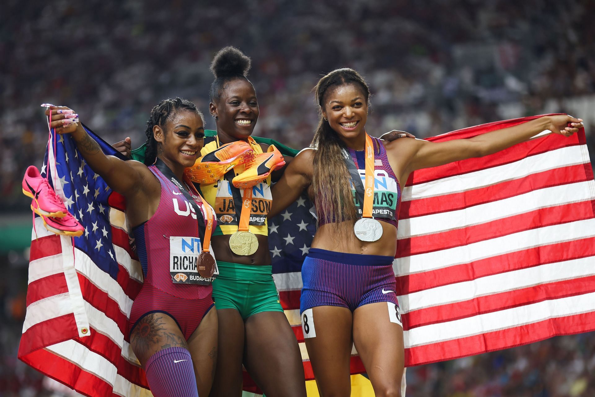 Sha&#039;Carri Richardson, Shericka Jackson, and Gabby Thomas celebrate after the Women&#039;s 200m Final during the 2023 World Athletics Championships in Budapest, Hungary.